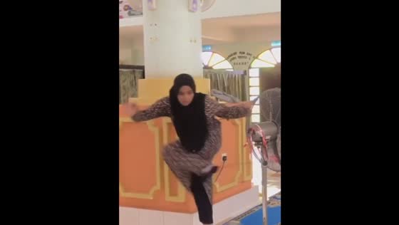 Friend trips over fan wire during mosque activity in Malaysia