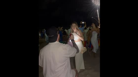 Proposal during New Year's fireworks in Itapema, Brazil