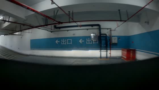 Cargo tricycle rolls backward into car in parking garage in Anhui, China