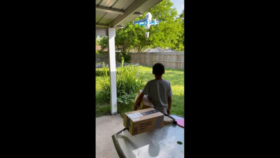 Kids react to Amazon drone delivery in Waco, Texas, USA