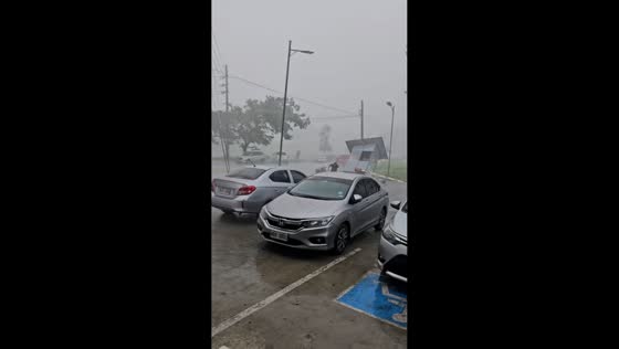 Powerful winds and heavy rain batter Quezon City in Philippines