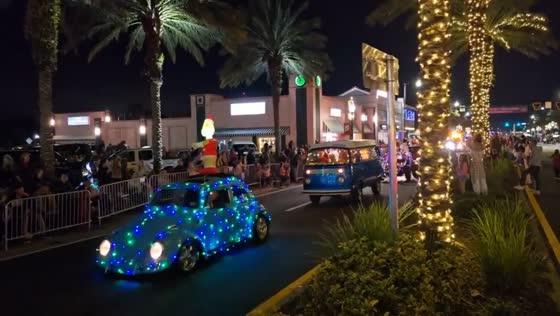Festive nighttime Christmas parade lights up Lake Worth Beach, USA