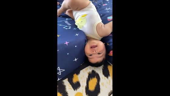 Joyful adventures: baby's playful mattress sandwich delights in new home