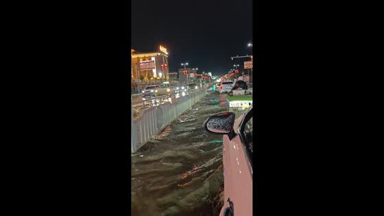 Severe flooding turns street into a rushing river in Xinjiang, China