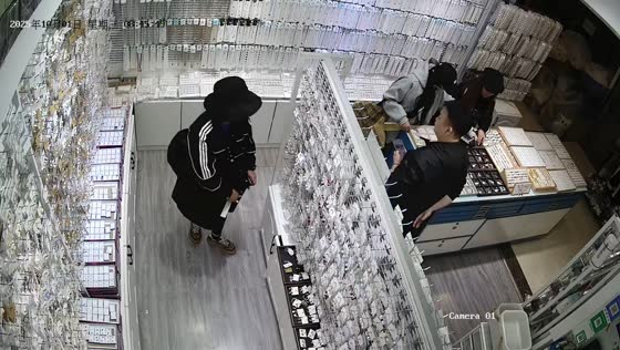 Girl sneaks necklaces in jewelry store in Sichuan Province, China