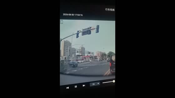 Car veers toward an e-bike rider before crashing into a lamp post in Shanghai, China