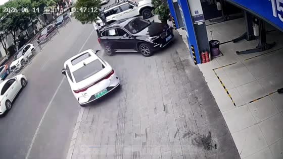 BMW hit by out-of-control EV in Mianyang crash near repair shop in Sichuan, China