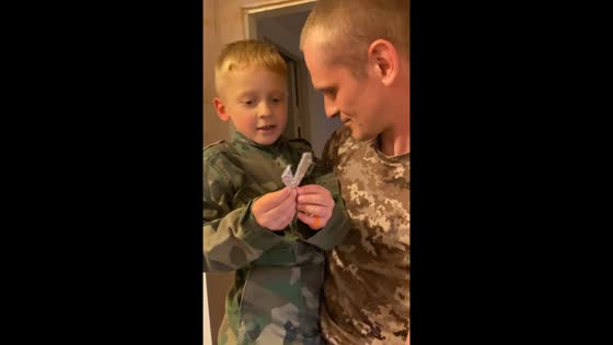 Father's surprise reunion with son after nine months apart