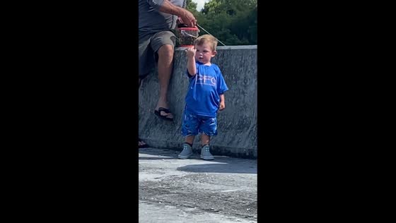 Little boy gives unexpected gesture while fishing in Florida, USA