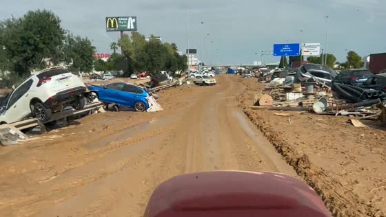 Hurricane Dana leaves streets filled with mud and displaced cars in La Pista de Silla
