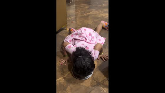 Girl hilariously imitates pet dog by licking plate in Dwarka, India