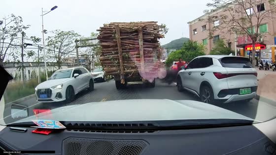 Truck exhaust smoke blows onto man on roadside in Guangdong, China