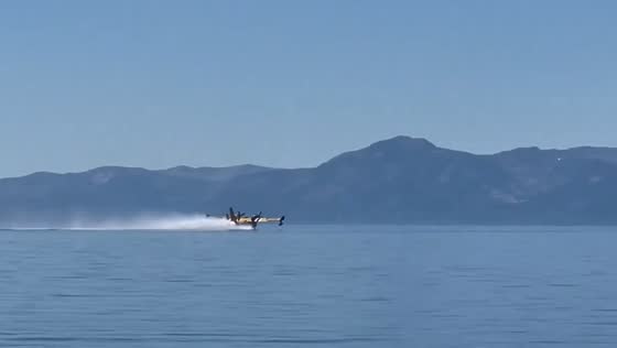 Plane fills water at Cedar Beach to fight Davis Fire in Nevada