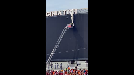 Skydiver rescued after getting stuck on stadium scoreboard in Blacksburg, Virginia, USA