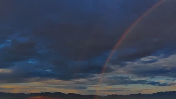 Double rainbow appears in evening sky in Magna, Utah, USA 
