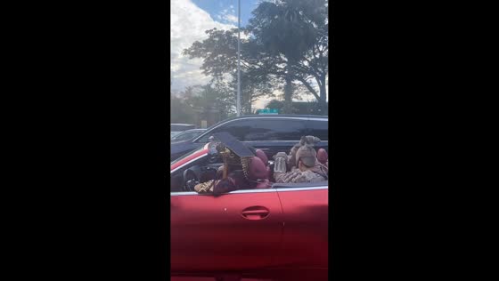 Dynasty-themed cosplay group dances in a convertible, Hainan, China