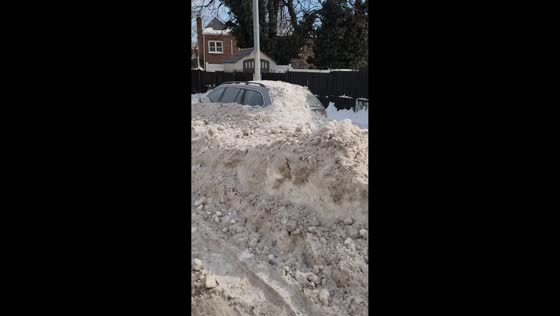 Snowstorm aftermath buries vehicles in Queens, New York, USA