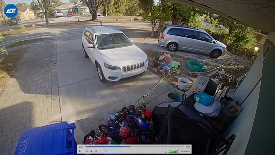 Woman and child trip over hose outside home in Fort Myers, Florida, USA