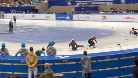 Canadian athlete's agile maneuvering amidst collision in short track speed skating World Cup final