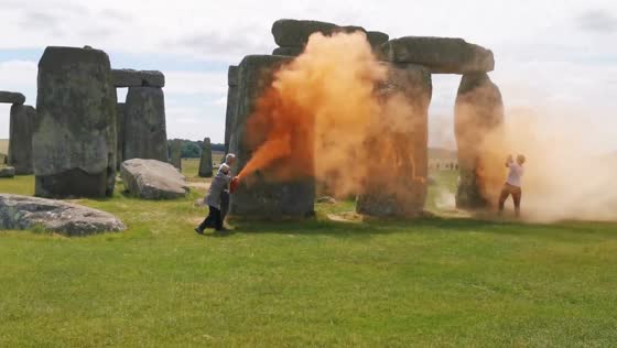 Climate activists spray Stonehenge orange in call for fossil fuel phase-out