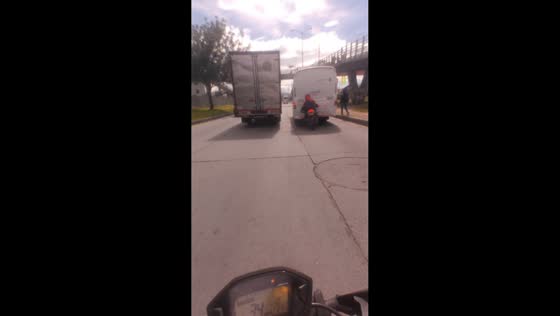 Motorcycle collides with bus on busy road in Soacha, Colombia 