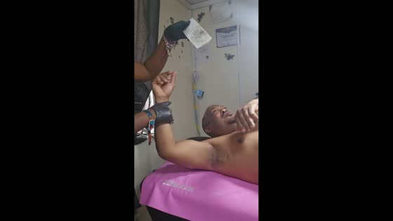 Father gets surprised during underarm waxing in Bridgetown, Barbados