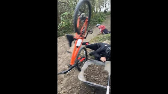Boys crash during muddy bike ride in Oxford, England, UK