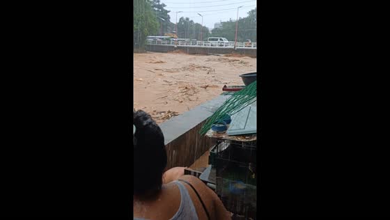 River swells and waters rage in San Mateo, Philippines due to Tropical Storm Yagi