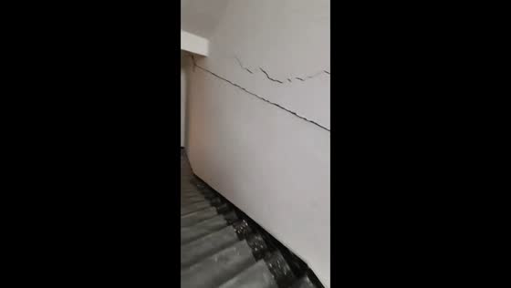 Hotel stairwell shows cracks and debris after 6.3-magnitude earthquake in Qinghai, China
