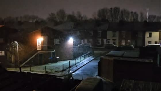 Heavy nighttime snowfall in Stanton Hill, England, UK