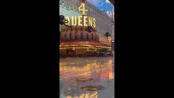 Vibrant nightlife under heavy rain at Fremont Street, Las Vegas, USA