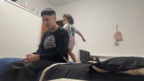 Playful slap during father-daughter bonding in Buenos Aires, Argentina
