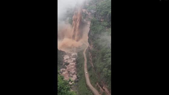 Muddy waterfall in Yunnan: nature's response to heavy rainfall