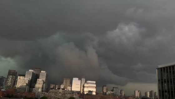 Massive dark storm cloud looms over Toronto skyline in Canada