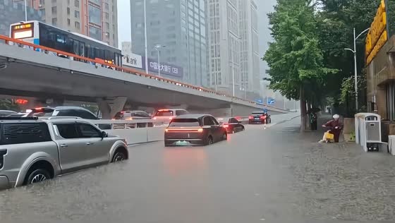 Torrential rain floods across Youth Street in Shenyang, China