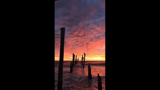 Stunning sunset over the remains of Redington Long Pier, Florida, USA
