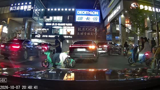 Electric scooter gets stuck in gutter grate at pedestrian crossing in Hunan, China