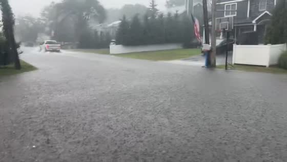 Torrential rain causes localized flooding in East Islip, New York