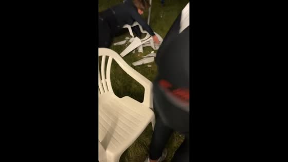 Man trips while attempting a jump over a plastic chair in Voiron, France