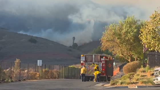 Helicopter water drop during Pyrite Fire containment in Riverside, California