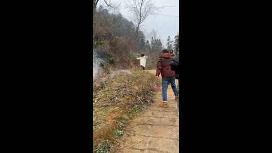 Woman slips near stream during outdoor gathering in Guizhou, China