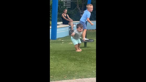 Boy hilariously loses balance on stand-up spinner in Miami, Florida, USA