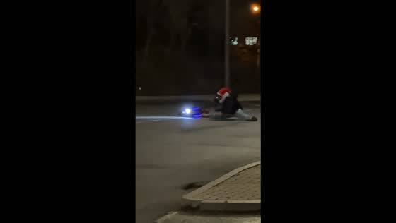 Scooter rider loses balance and falls while attempting a turn in Ávila, Spain