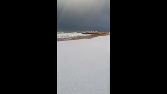 Snow falls along seaside beach in Miramar, Buenos Aires, Argentina