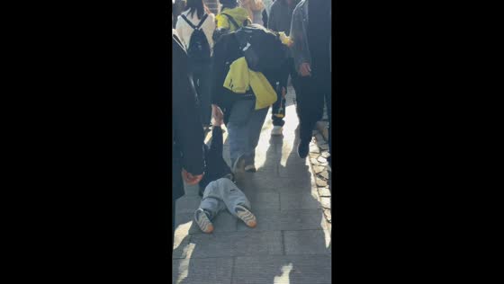 Tired boy adorably gets pulled up the Great Wall by his mom in Beijing, China