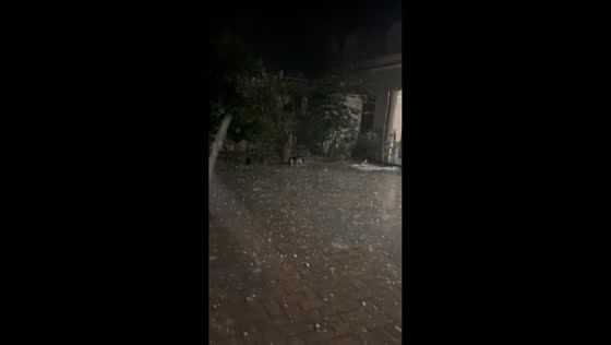 Severe hailstorm blankets streets and disrupts power in Mardan, Pakistan