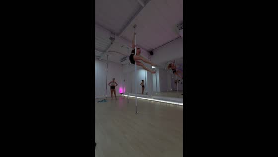 Pole dancer suddenly loses her grip and falls to the floor in Saint-Leu-la-Forêt, France