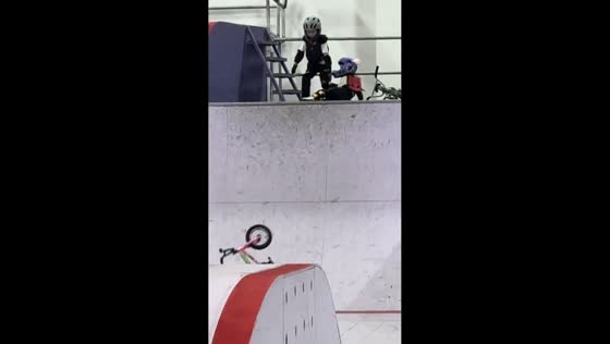 Child falls after reaching top of steep ramp in Beijing, China