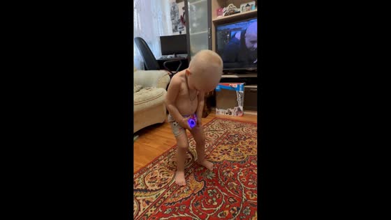 Child dances with glowing ball in pants in Krasnodar, Russia
