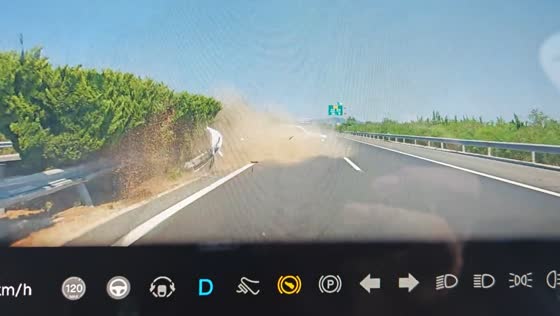 Car crashes into road barrier after overtaking on highway